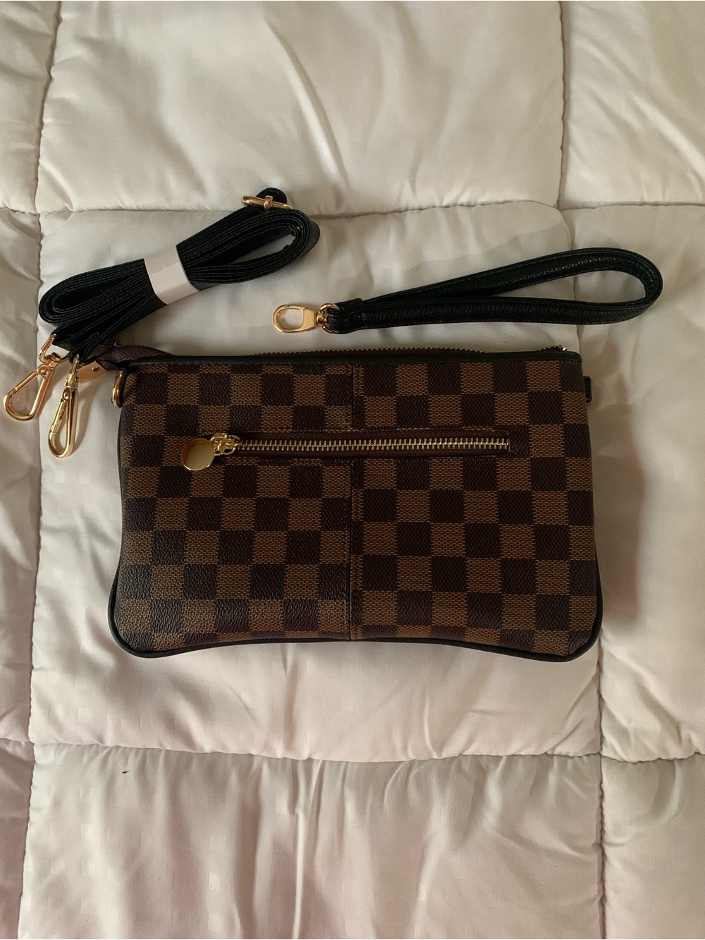 Brown small purse with a crossover/shoulder strap and wrist strap